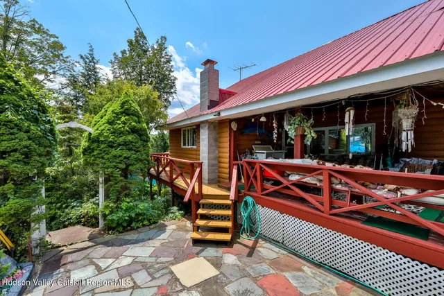 an aerial view of a house with yard swimming pool and outdoor seating