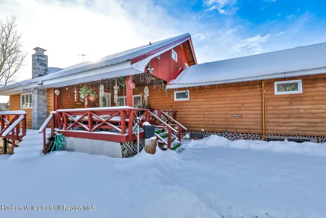 an aerial view of a house with yard swimming pool and outdoor seating