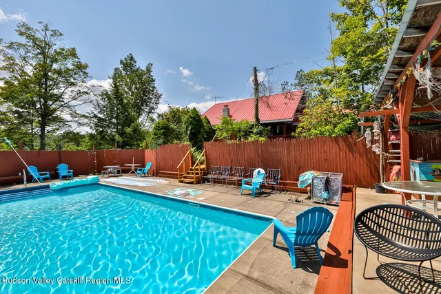 a large kitchen with a table and chairs