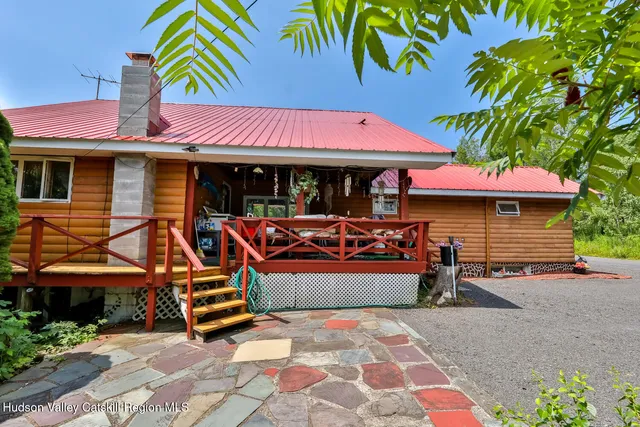 a bedroom with a bed and wall painting