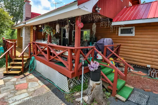 a backyard of a house with outdoor seating