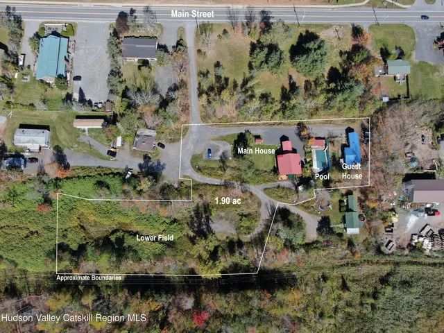 a view of a patio with a table and chairs