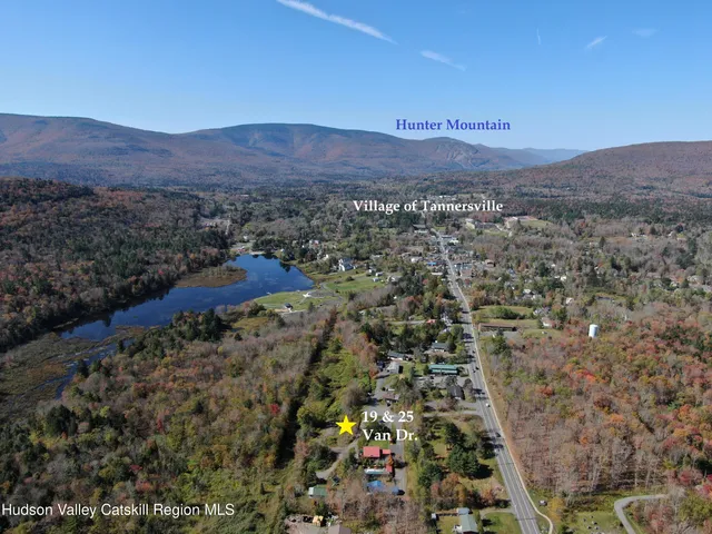 a view of balcony with chairs and wooden fence