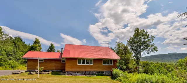 a view of outdoor sitting area with chairs