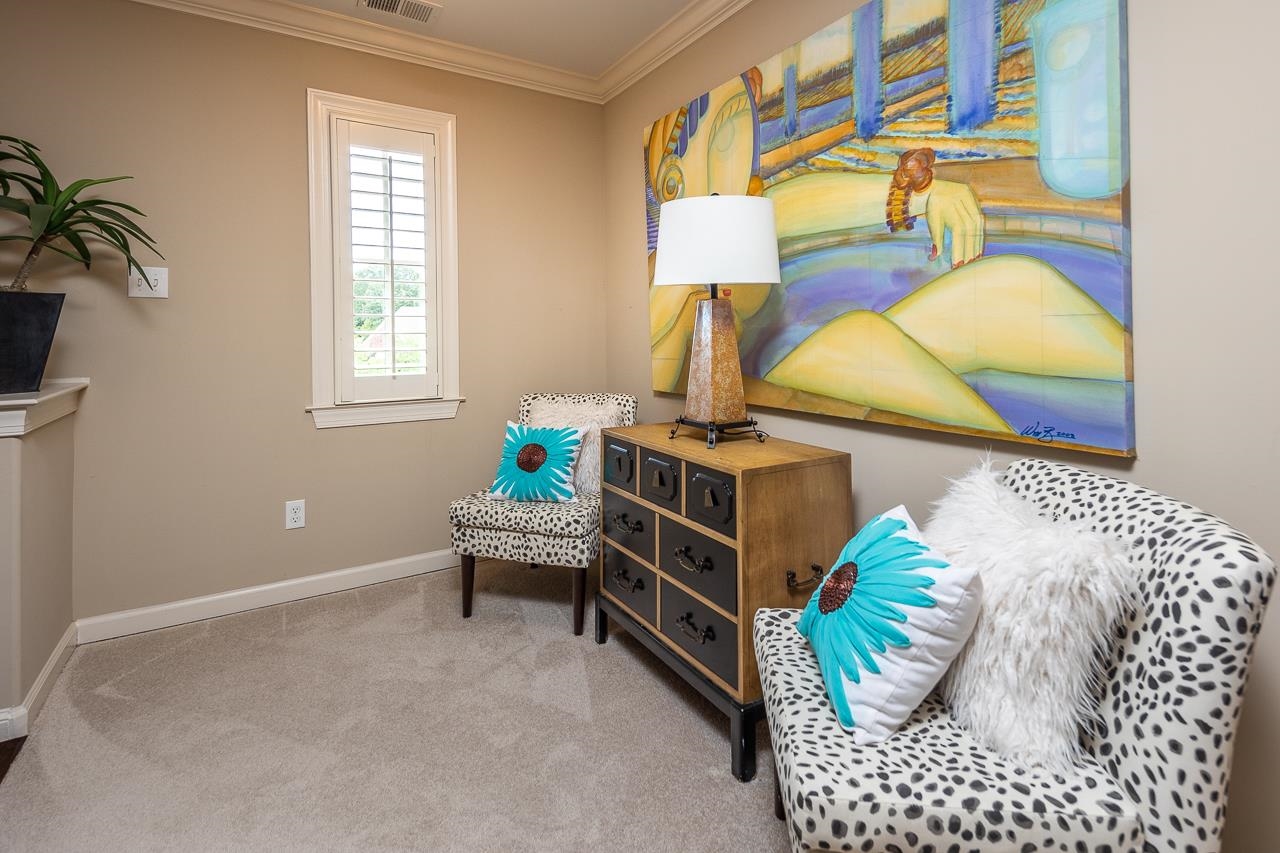 771 Six Oaks Lane Collierville, TN 38017 - Photo 17 of 25 a bed room with a bed and a lamp