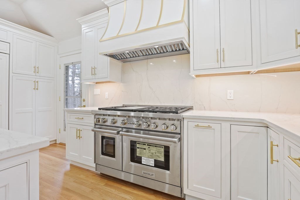 80 Doublet Hill Road Weston, MA 02493 - Photo 14 of 38 a stove top oven sitting inside of a kitchen