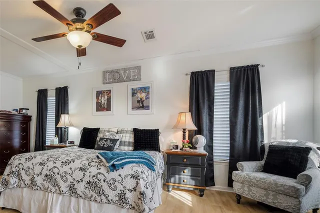 a bedroom with a bed and a couch