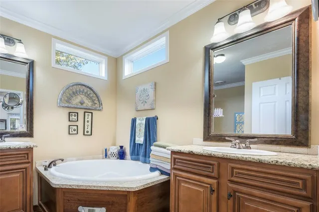 a bathroom with a granite countertop sink a toilet and a mirror