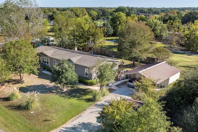 an aerial view of residential house with outdoor space