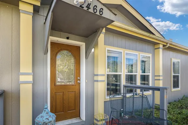a front view of a house with a glass door