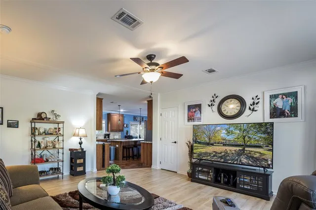 a view of a livingroom with furniture and a large window