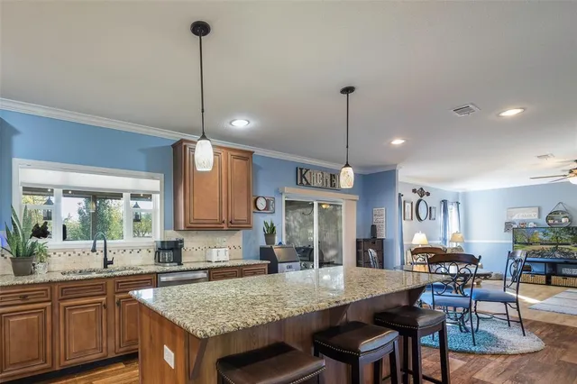 a kitchen with a table and chairs in it