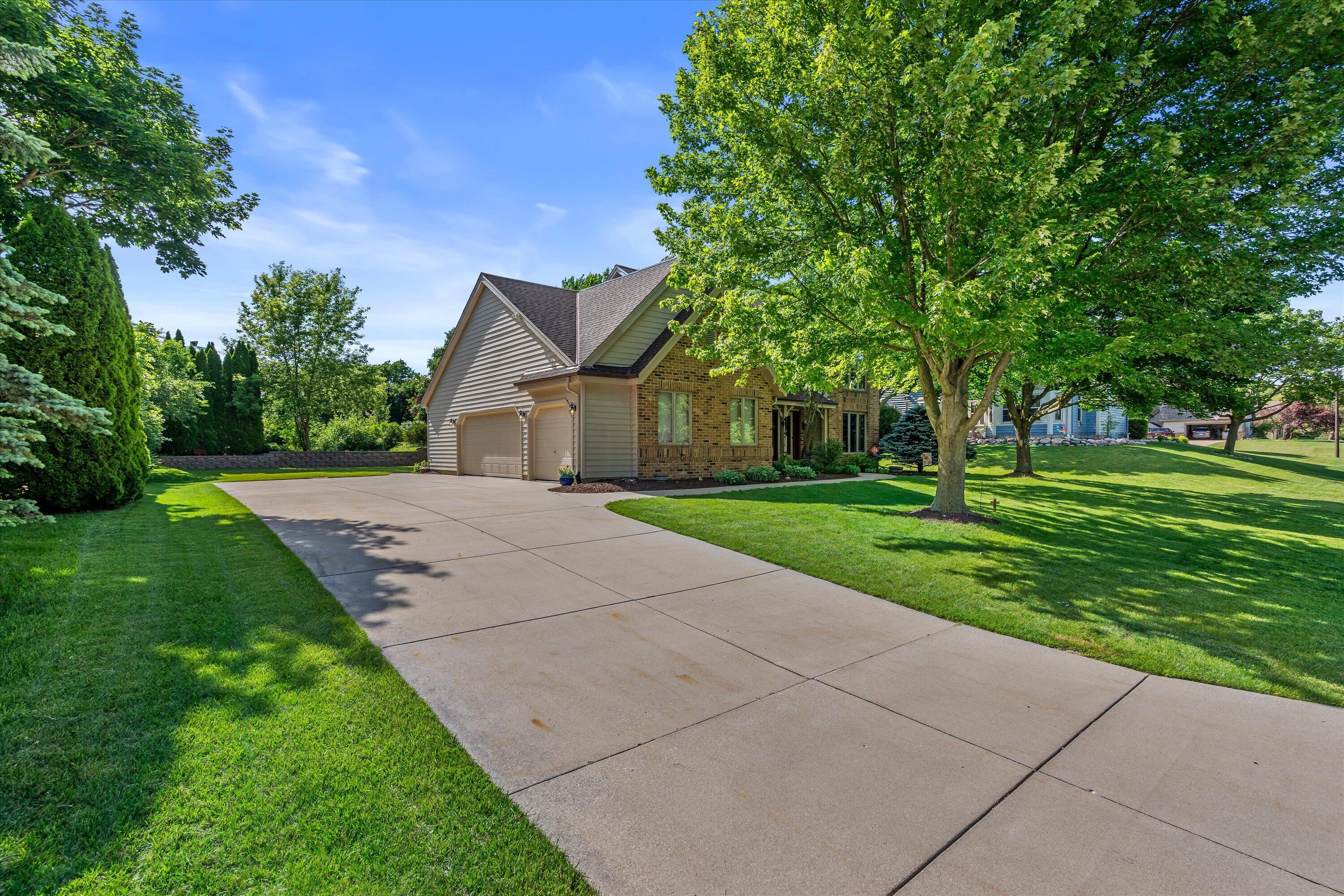 W168N5039 Stonefield Road Menomonee Falls, WI 53051 - Photo 2 of 34 3.5-Car Attached Garage