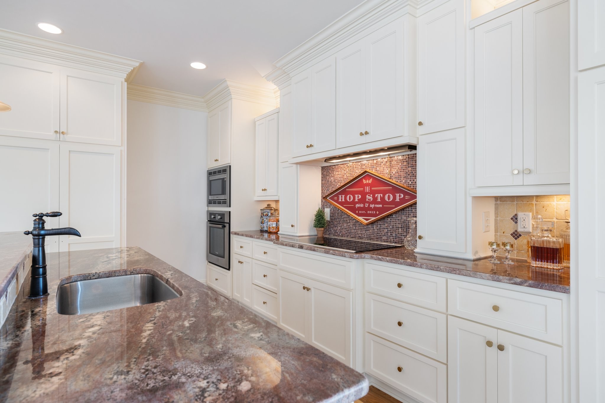 2019 Tabitha Drive Franklin, TN 37064 - Photo 40 of 69 a kitchen with granite countertop a sink and a stove top oven