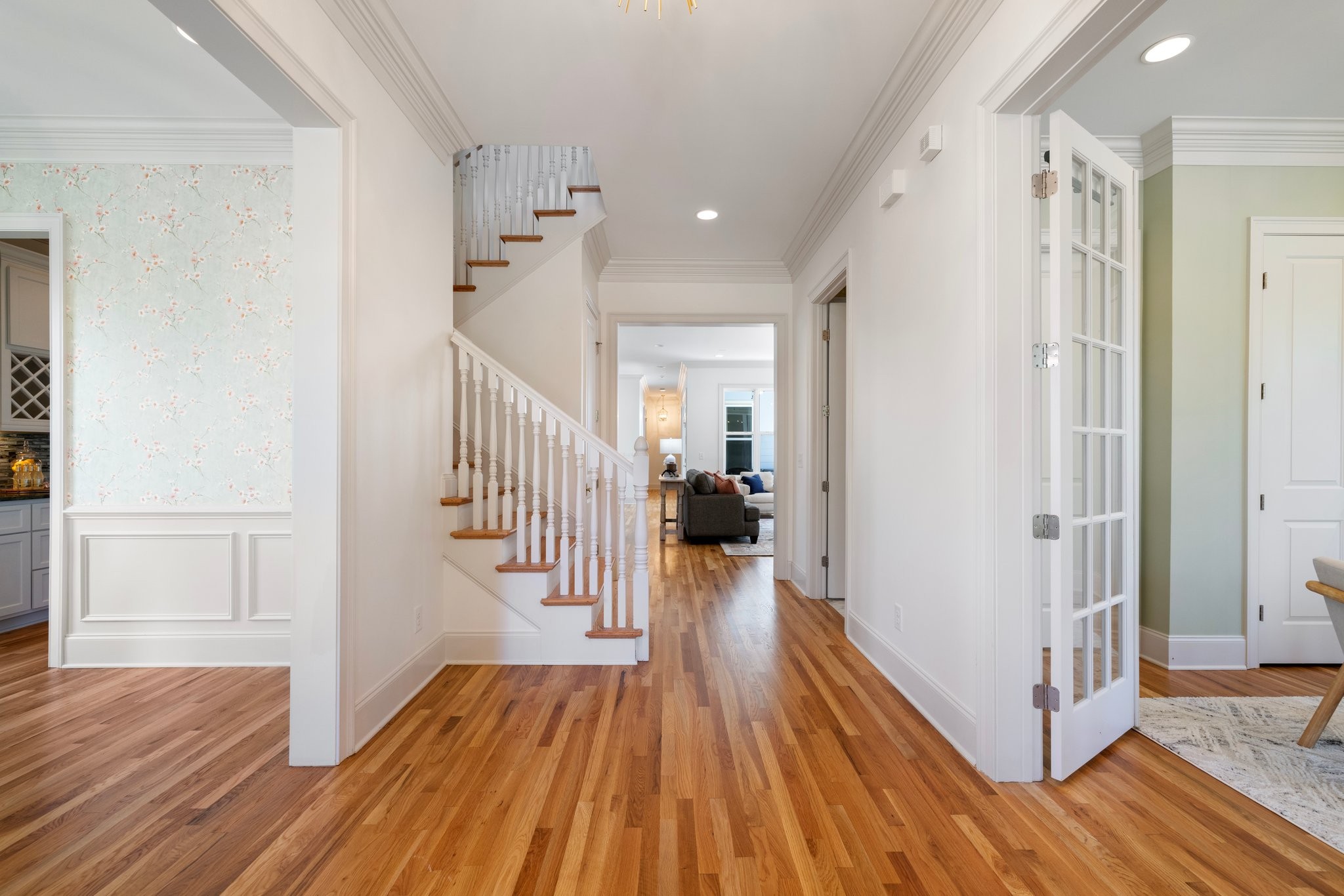 2019 Tabitha Drive Franklin, TN 37064 - Photo 7 of 69 a view of a hallway with wooden floor and staircase