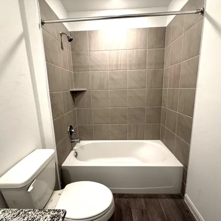 an empty room with a empty space and windows