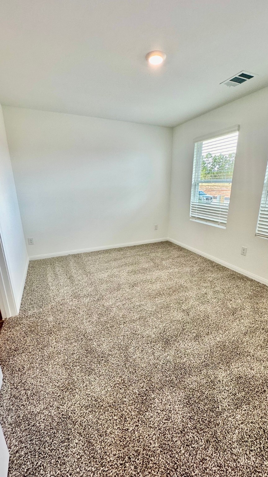 11926 Midas Lane Willis, TX 77378 - Photo 19 of 28 an empty room with a natural light