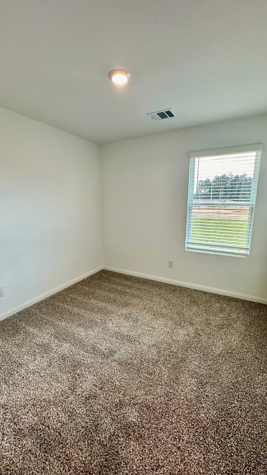 11926 Midas Lane Willis, TX 77378 - Photo 25 of 28 an empty room with a window