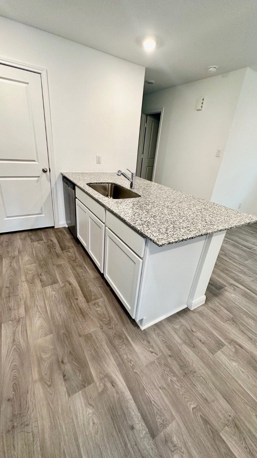 11926 Midas Lane Willis, TX 77378 - Photo 6 of 28 a kitchen with stainless steel appliances granite countertop a sink and a stove