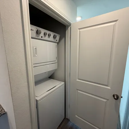 a view of storage and utility room with empty racks