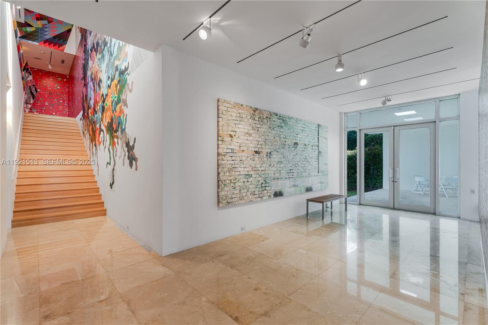 5 Harbor Point Key Biscayne, FL 33149 - Photo 15 of 81 a view of hallway with furniture and a painting