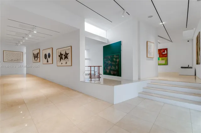 a large kitchen with a table and chairs