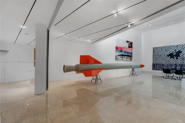 a kitchen with appliances a sink a counter top space and cabinets