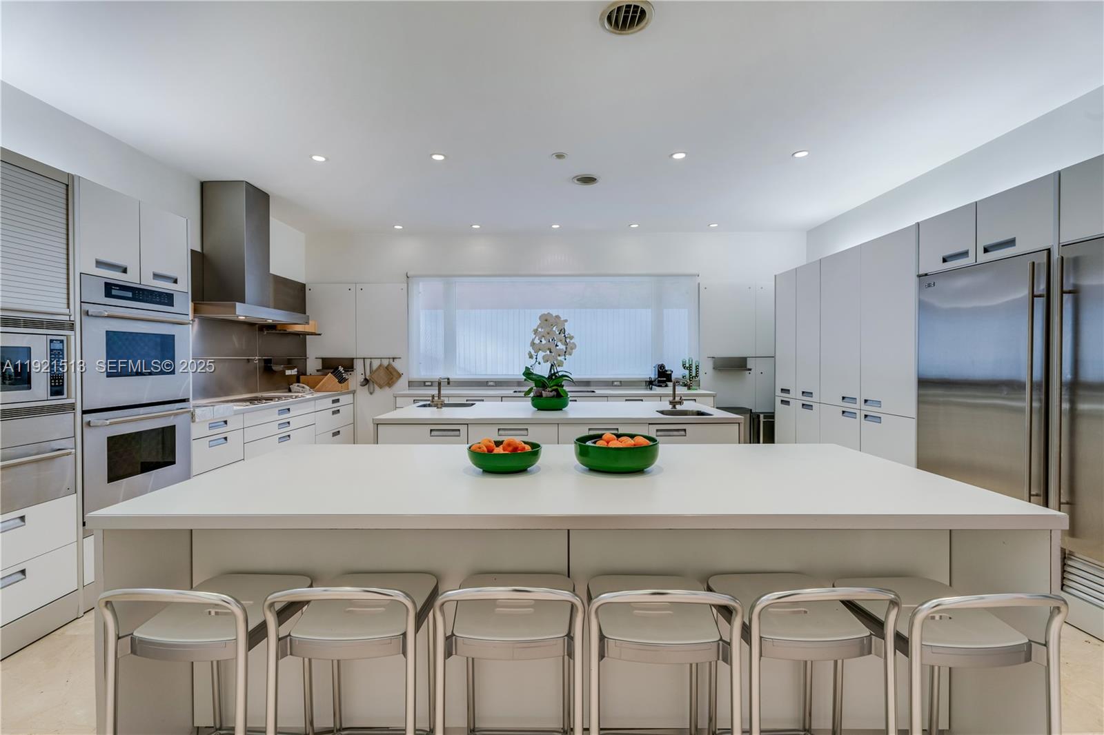 5 Harbor Point Key Biscayne, FL 33149 - Photo 54 of 81 a large kitchen with a table and chairs