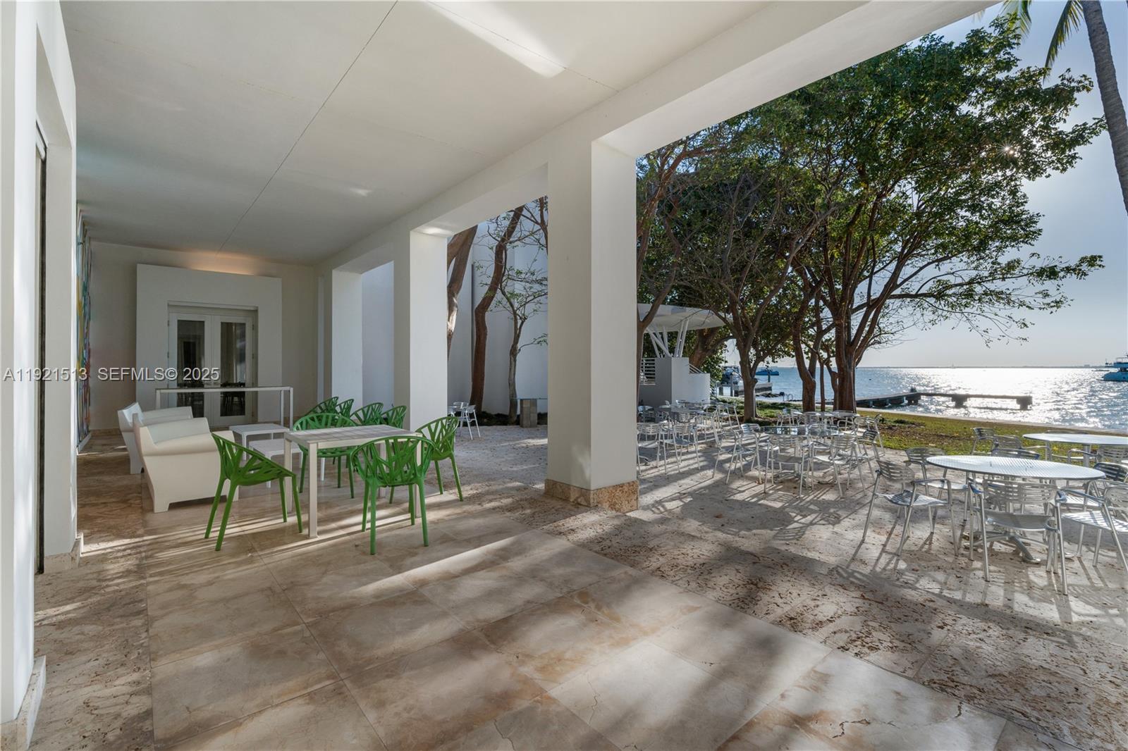 5 Harbor Point Key Biscayne, FL 33149 - Photo 59 of 81 a view of a porch with chairs and backyard