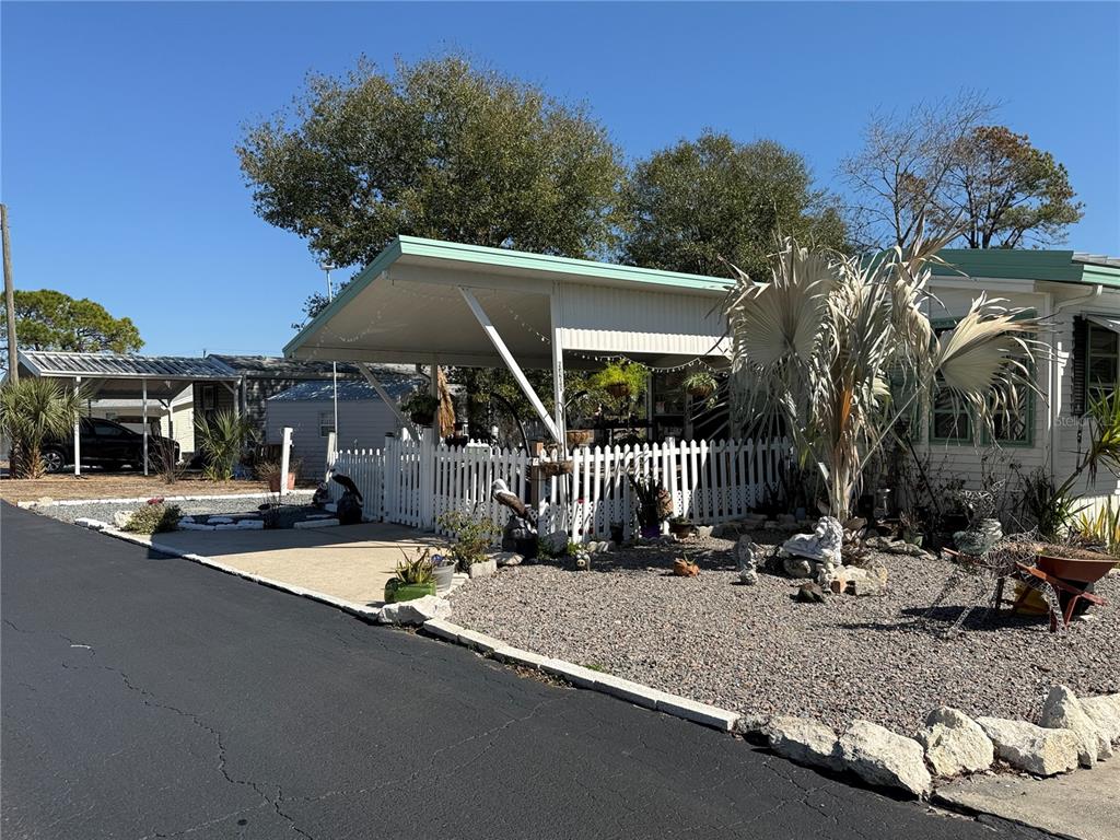 9408 Cougar Drive Weeki Wachee, FL 34613 - Photo 2 of 27 a view of a house with backyard and sitting area