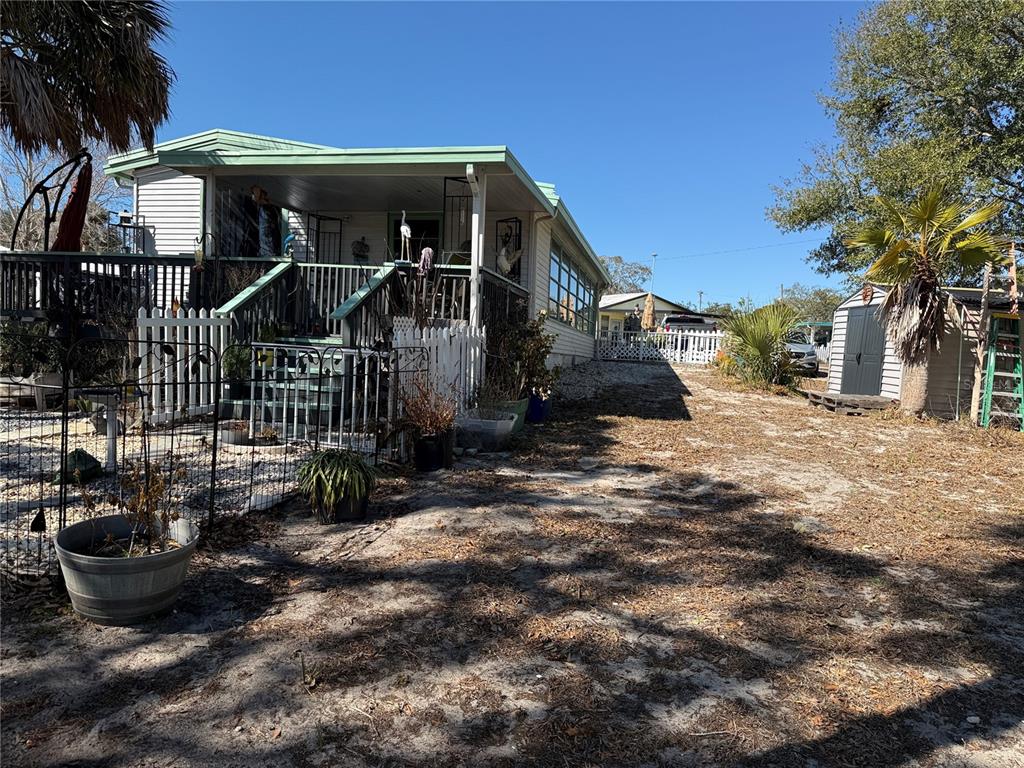 9408 Cougar Drive Weeki Wachee, FL 34613 - Photo 21 of 27 a view of a house with a yard