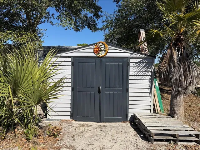 a view of a backyard with a small cabin