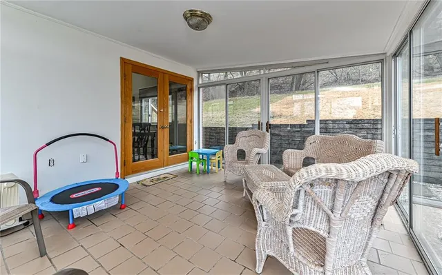 a living room with furniture a window and a fireplace
