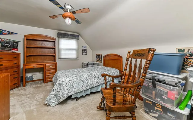 a bedroom with furniture and a window