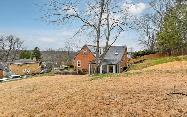 a view of a house with snow on the road