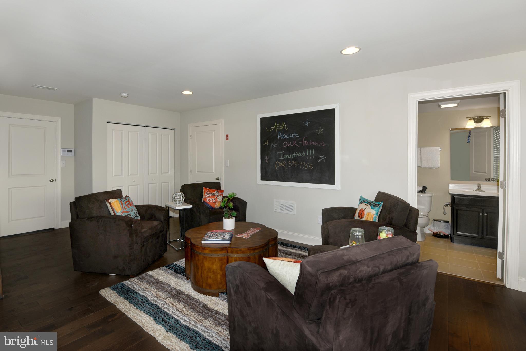 442 Rederick Lane Middletown, DE 19709 - Photo 14 of 22 a living room with furniture a flat screen tv and a fireplace