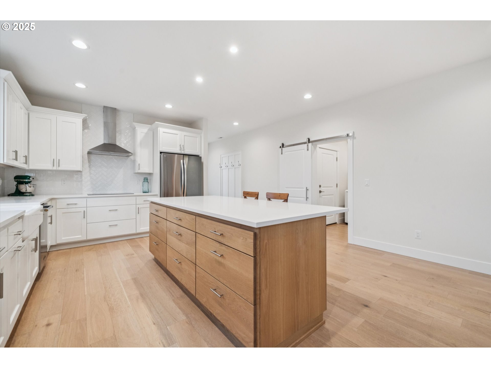 224 Southwest 18th Avenue Canby, OR 97013 - Photo 12 of 40 a large kitchen with kitchen island a sink stainless steel appliances and cabinets