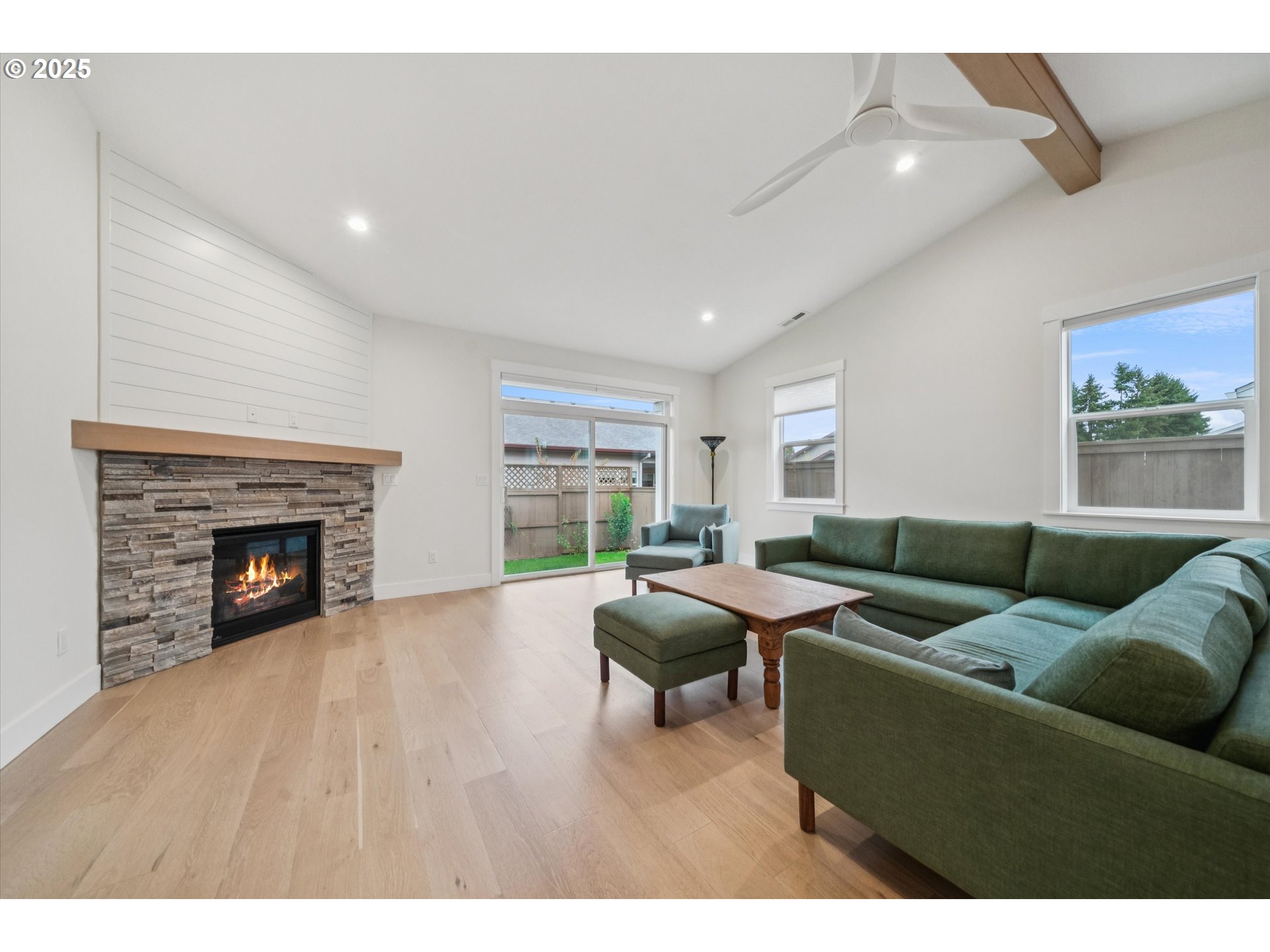 224 Southwest 18th Avenue Canby, OR 97013 - Photo 5 of 40 a living room with furniture and a fireplace
