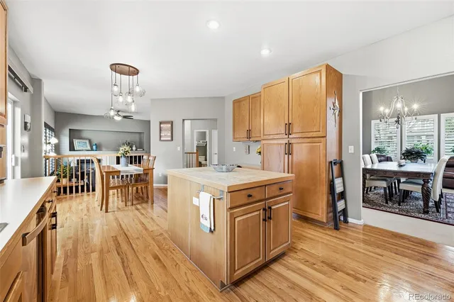 a kitchen with stove and refrigerator