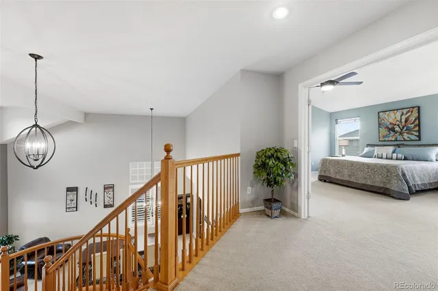 a view of a livingroom with furniture and staircase