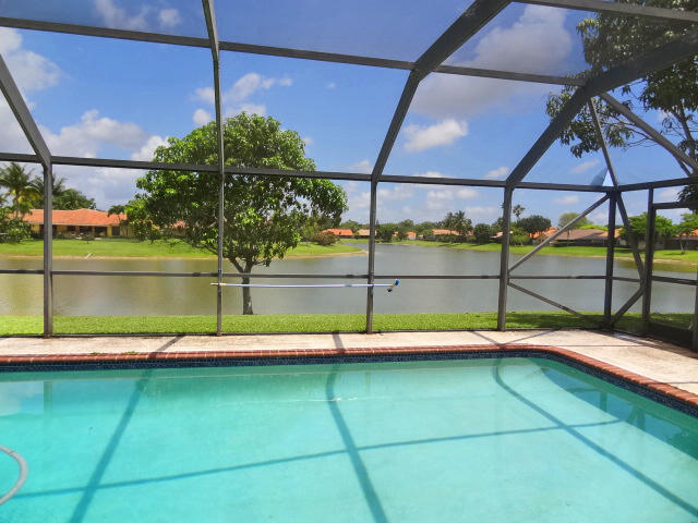 11341 Lake Tree Court Boca Raton, FL 33498 - Photo 3 of 28 LARGE SCREEN POOL OVERLOOKING LAKE