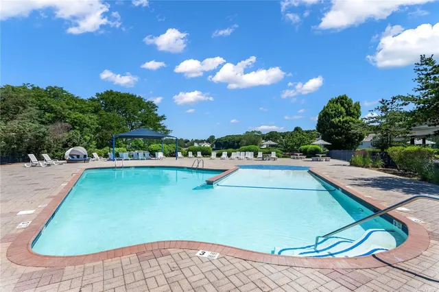 a view of swimming pool from a balcony