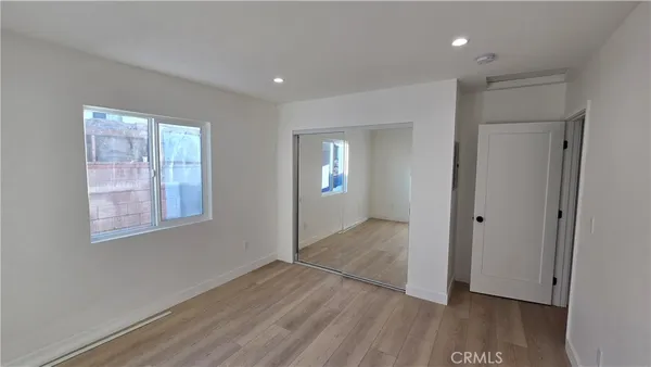a view of livingroom with hardwood floor and hallway