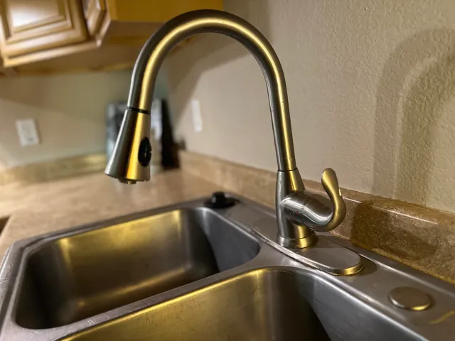 an empty room with closet and windows