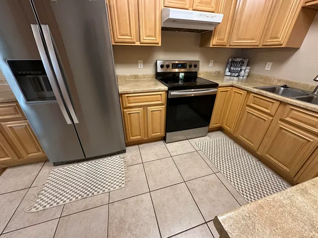 a view of a yard with a tree