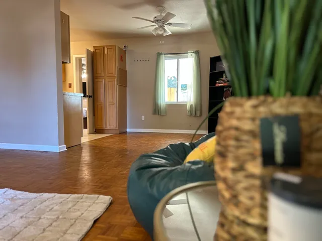 a kitchen with a refrigerator a sink and cabinets