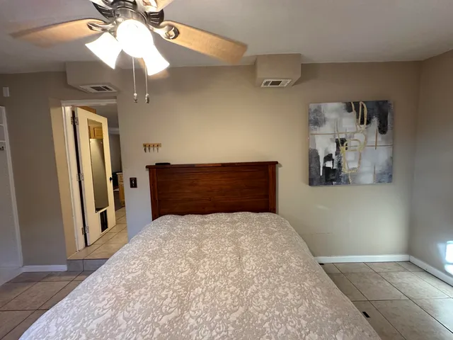 a view of a backyard with a tree