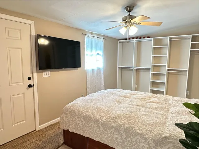 a view of a chairs and table in backyard of the house