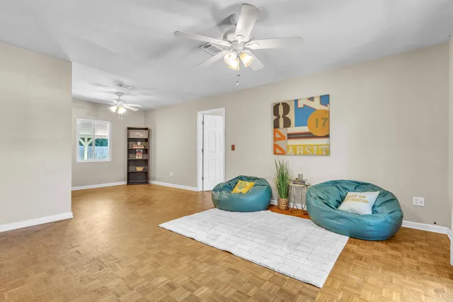a view of kitchen with stove and refrigerator