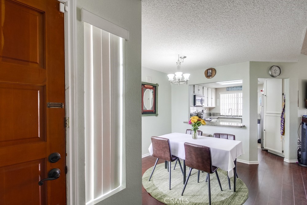 1567 Apache Drive, Unit A Chula Vista, CA 91910 - Photo 12 of 51 a view of a dining room with furniture and wooden floor